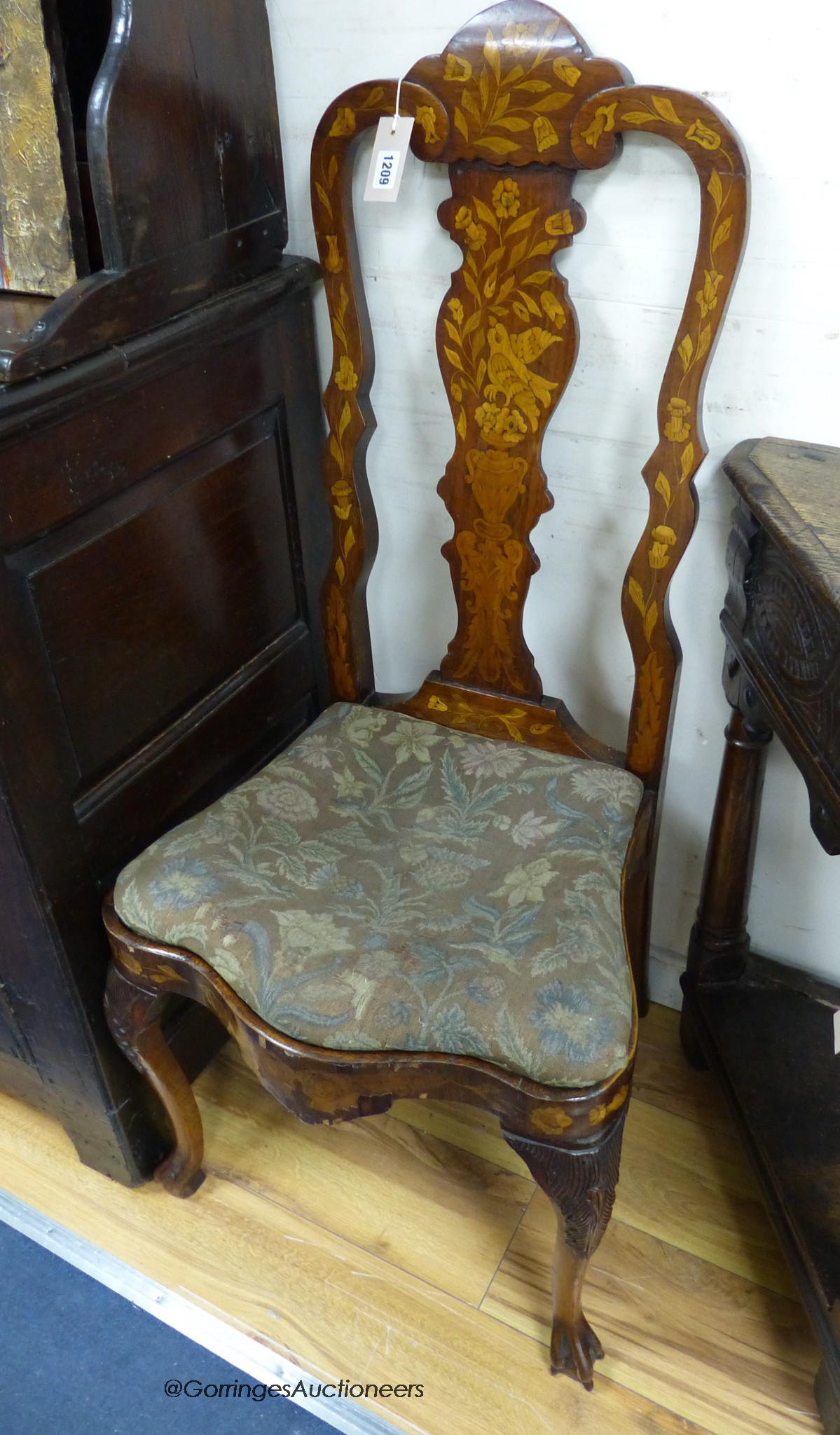 A pair of late 18th century Dutch floral marquetry walnut high back dining chairs